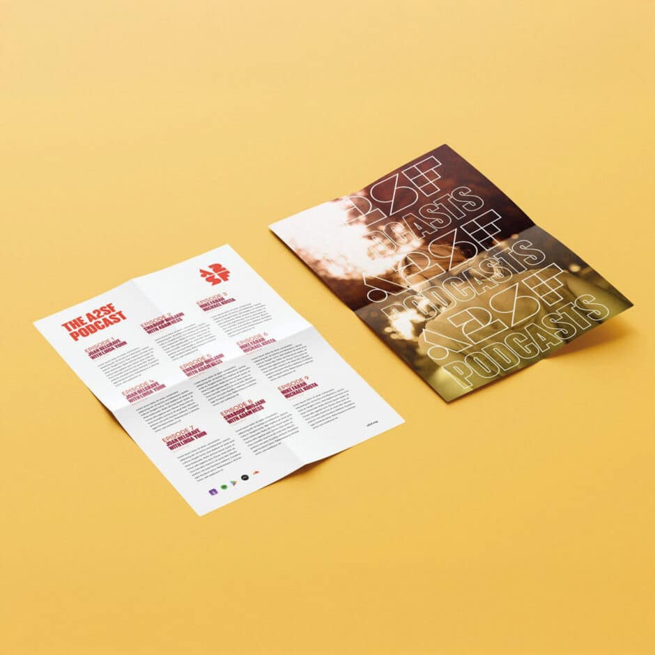 Two folded brochures on a light yellow background. The left one has red text about a podcast; the right one features blurred sunlight with "PODCASTS" text.