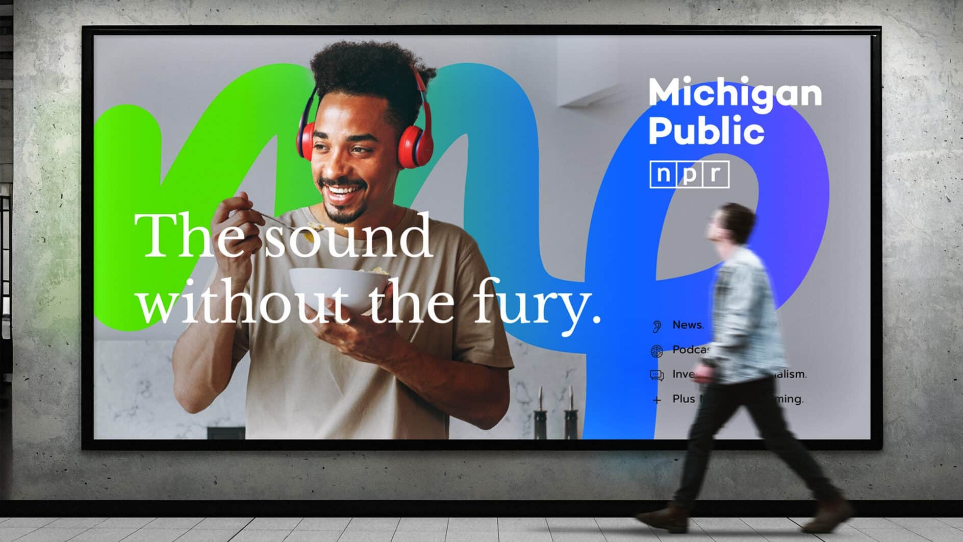 A man wearing red headphones smiles while the text "The sound without the fury" overlays. "Michigan Public NPR" is visible. Bright, modern setting.