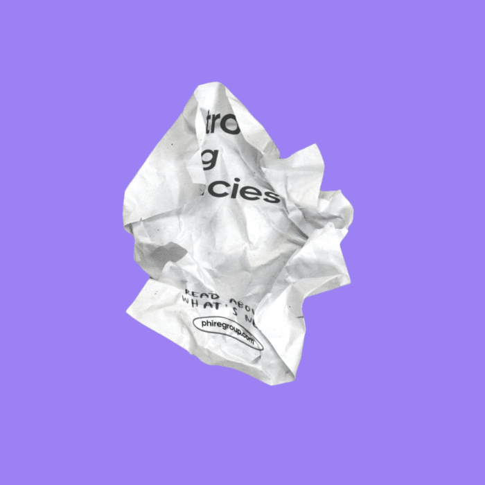 Crumpled white paper with partial black text on a purple background. Words like "agencies" and a website are visible, conveying a sense of neglect or frustration.