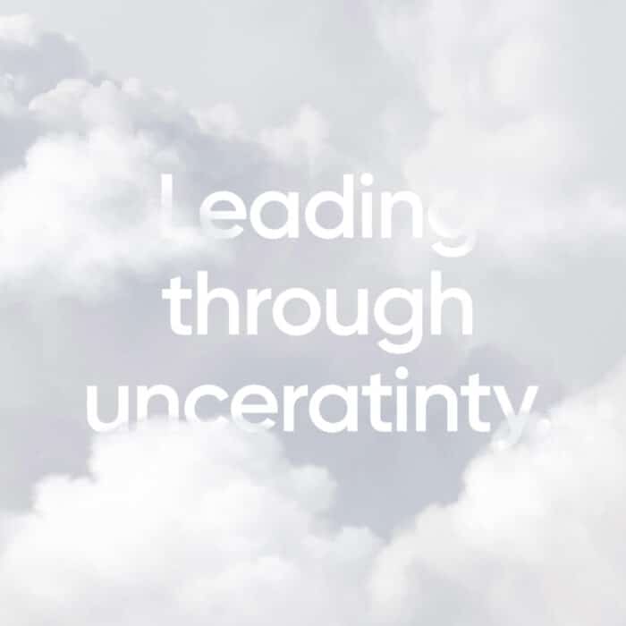 Text "Leading through uncertainty" appears against a soft, cloudy sky background, conveying a sense of calm and resilience.